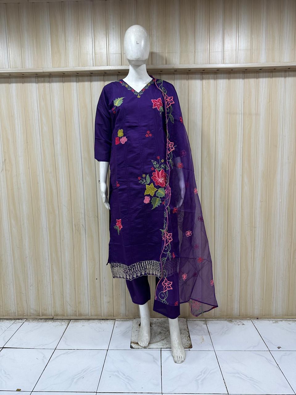 The description doesn’t quite match the image — this is actually a rich purple (royal violet) embroidered kurti set, not grey. And it looks stunning