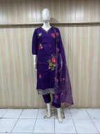 The description doesn’t quite match the image — this is actually a rich purple (royal violet) embroidered kurti set, not grey. And it looks stunning