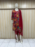 This is a stylish red floral printed kurti set displayed on a mannequin, featuring:  Bold multicolor floral print (yellow, green, beige tones) 🌸
