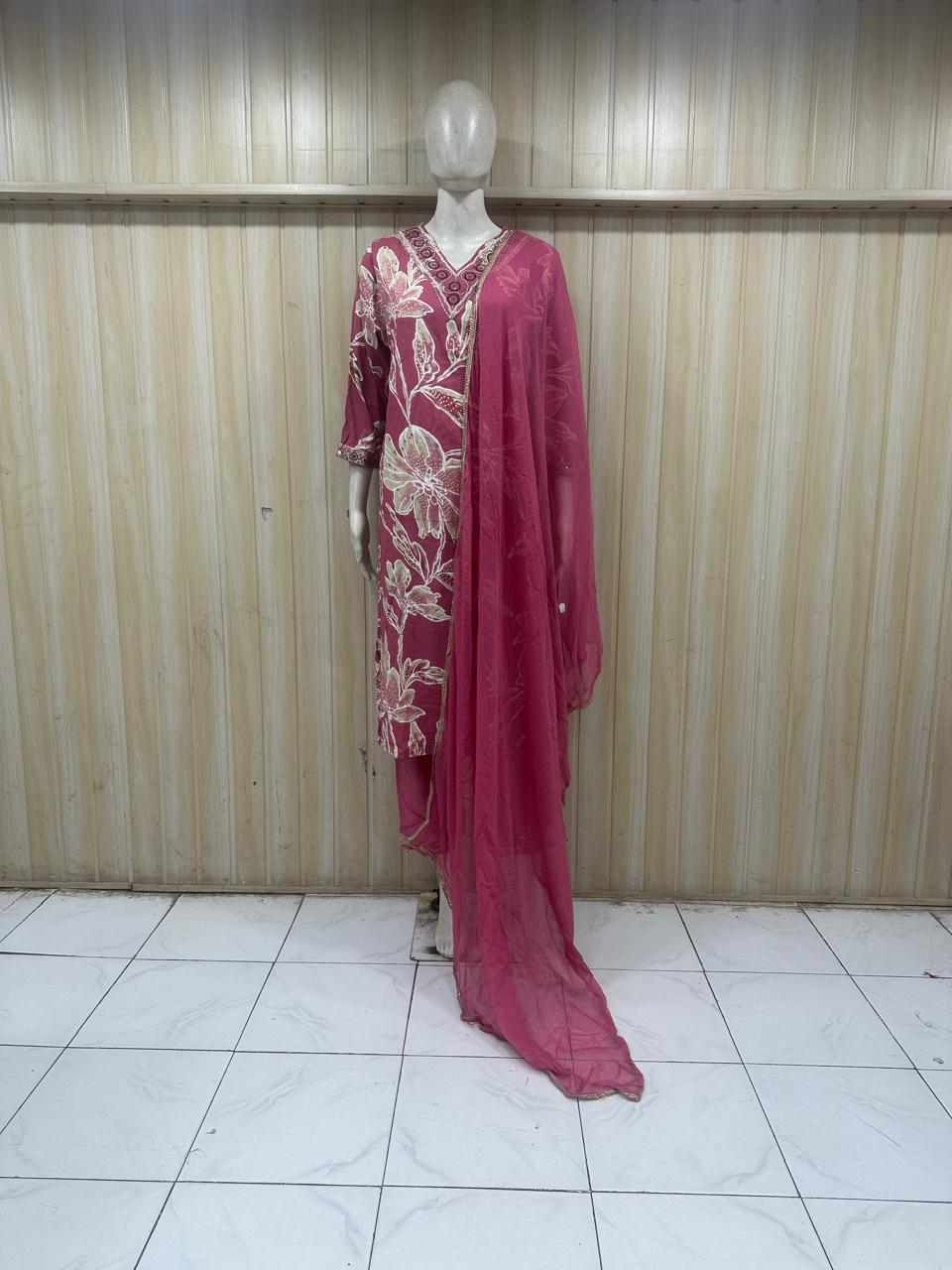This is a mannequin display image of a pink traditional kurti set with dupatta. It looks like a shop/store photo, not a photoshoot, but the outfit itself is very suitable for premium styling.