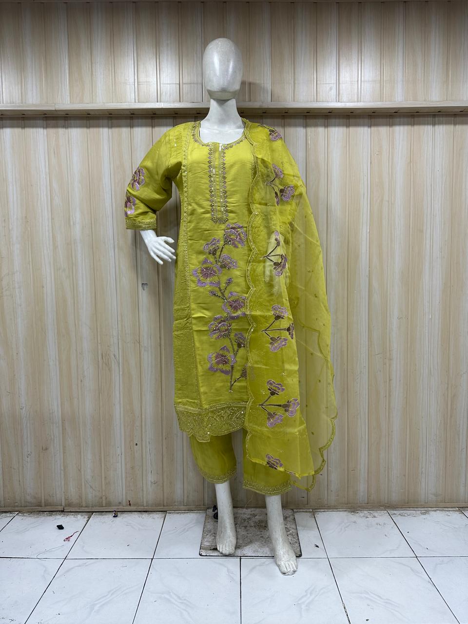 Not blue 🙂 — this is a yellow (mustard) embroidered kurti set.