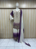 mannequin weaering a traditional white and purple embroidered outfit a against a wooden panel backgrauond