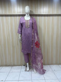 purple embroidered a traditional outfit with a red floral design on a mannequin against a striped wall