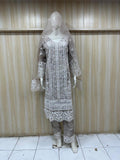 mannequin wearing traditional outfit with a intricate patterns against a striped wall