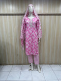 mannequin wearing patterned pink traditional outfit with a matching dupatta headscraf against a striped wall