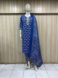 mannequin wearing a blue and white patterned traditional outfit with a matching dupatta shawl headscraf against a striped wall