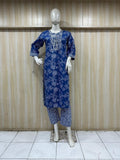 mannequin wearing a blue outfit with Floral Traditional against a wooden panel background