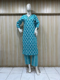 mannequin wearing a teal outfit with dress Floral Traditional against a wooden panel background