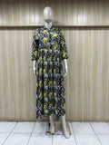 mannequin wearing a floral dress outfit with colorful dupatta Traditional against a wooden panel background