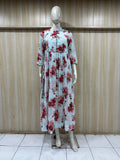 mannequin wearing a white floral dress outfit with Traditional against a wooden panel background