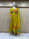 mannequin wearing a yallow floral dress outfit with Traditional against a wooden panel background