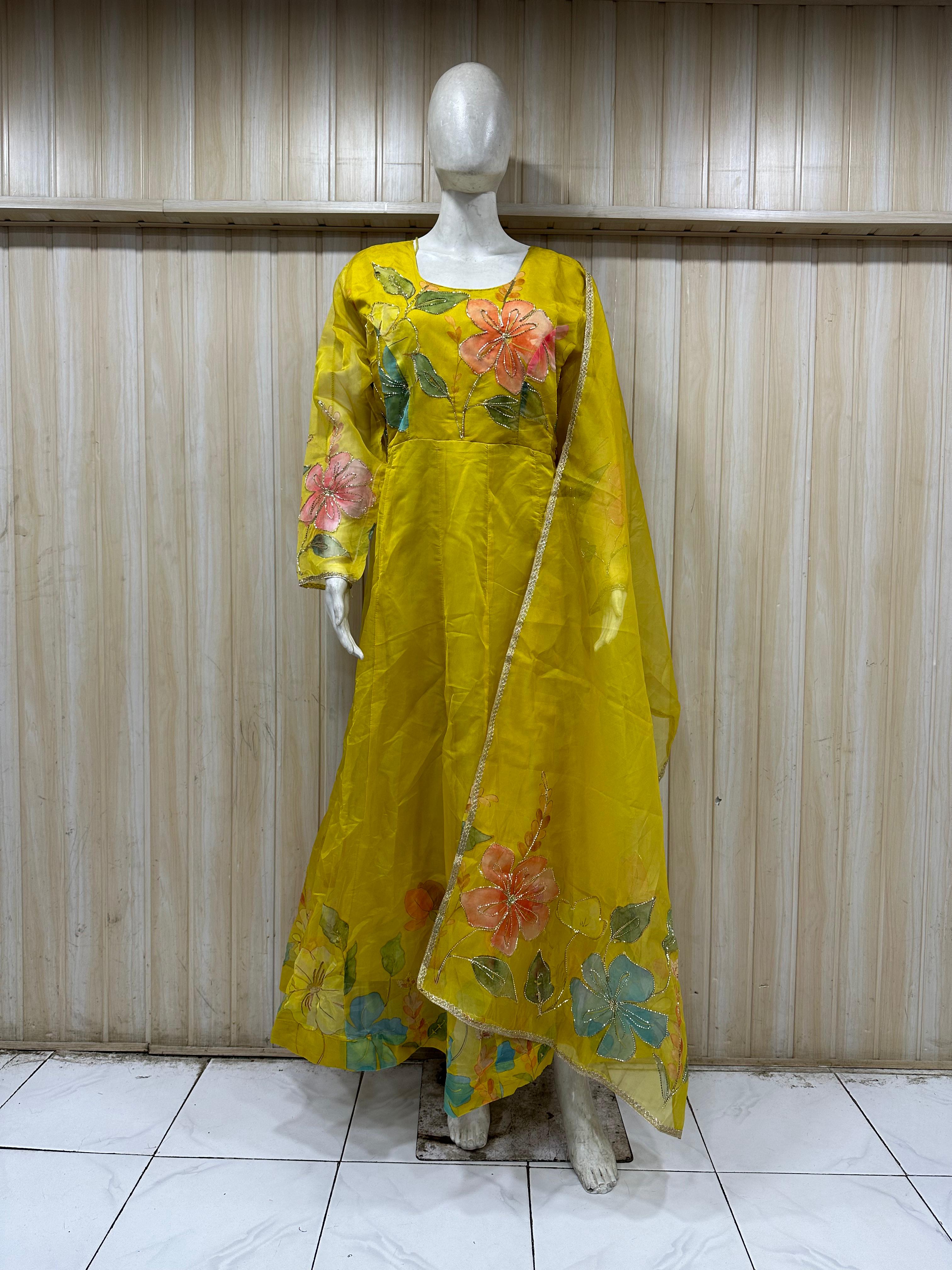 mannequin wearing a yallow floral dress outfit with Traditional against a wooden panel background