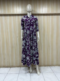 mannequin wearing a purpal and white floral dress outfit with Traditional against a wooden panel background