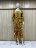mannequin wearing a blue floral dress emboridered outfit with Traditional against a wooden panel background