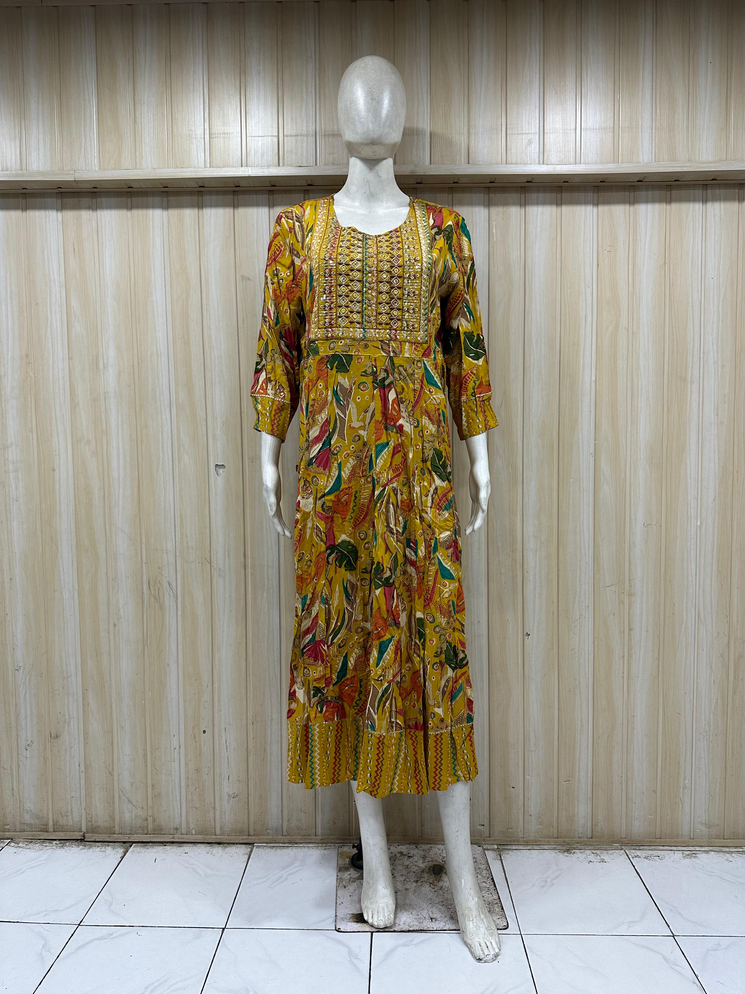 mannequin wearing a blue floral dress emboridered outfit with Traditional against a wooden panel background