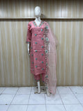 Mannequin wearing a pink embroidered outfit with a matching dupatta against a striped