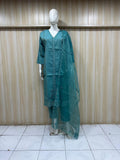 Mannequin wearing blue traditional outfit with white floral patterns against