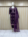 purpal kurta with pink and gold embroidery paired with a red and gold dupatta on a mannequin against a striped