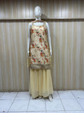 Mannequin wearing a floral top and yellow skirt against a striped