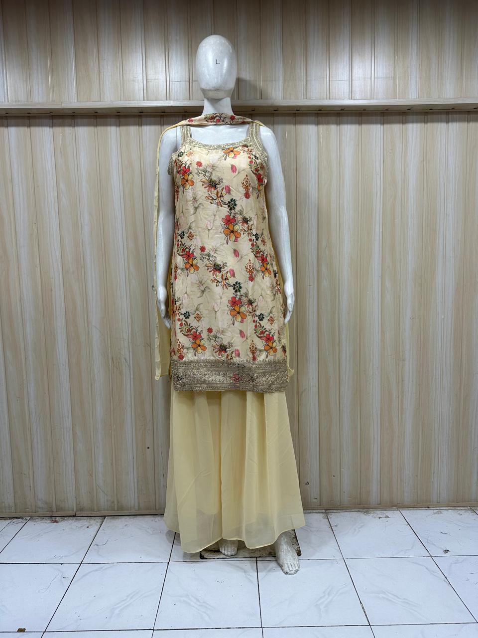 Mannequin wearing a floral top and yellow skirt against a striped