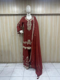 mannequin wearing a brouwn embroidered outfit against a striped