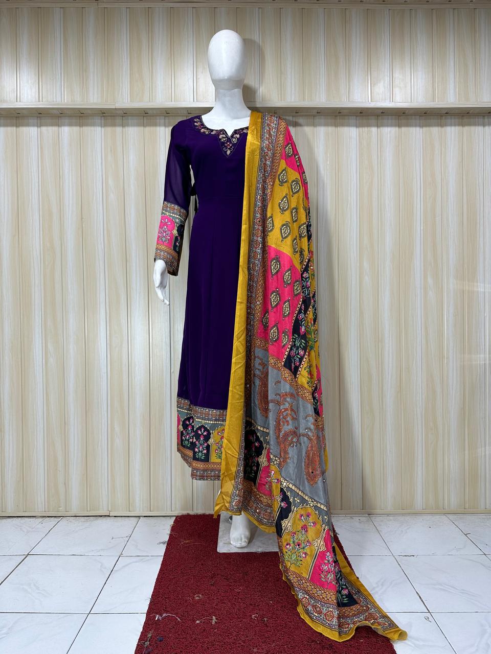 Mannequin wearing a purple dress with a colorful dupatta against a stripe