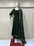 Mannequin wearing a dark green outfit with a matching dupatta against a striped