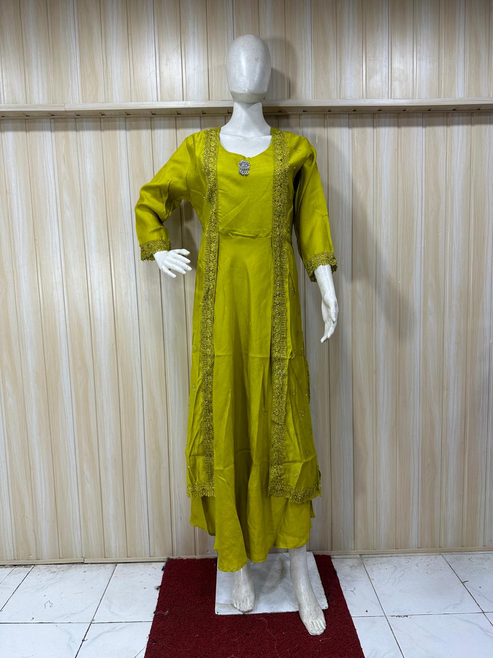 Mannequin wearing a green traditional outfit with a striped