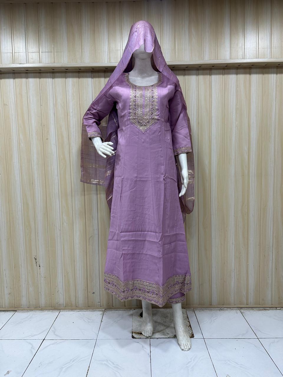 Purple dress with a hood on a mannequin against a striped