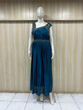 Mannequin wearing a teal dress with floral embellishments against a striped