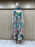 Mannequin wearing a floral dress against a wooden panel background