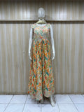 Mannequin wearing a floral dress against a striped