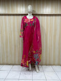 Mannequin wearing a pink floral dress against a striped