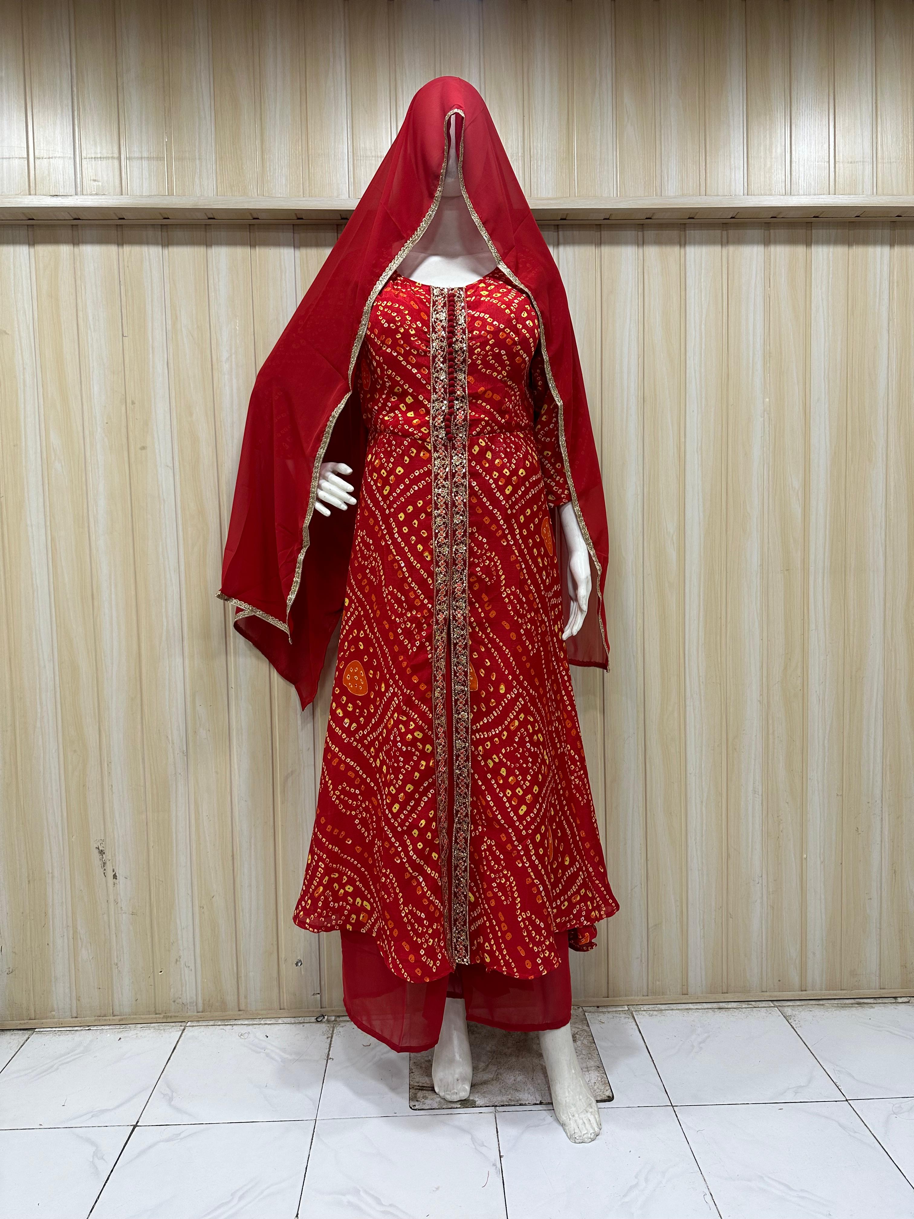 Red embroidered dress with matching dupatta on a mannequin against a striped