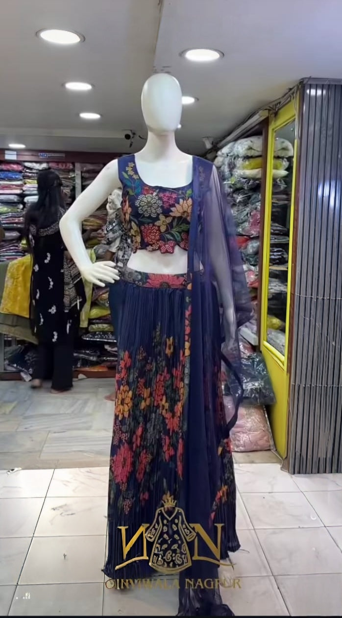 Mannequin wearing a floral dress with a store interior in the background