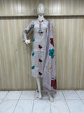 Mannequin wearing a white dress with colorful butterfly patterns against a striped