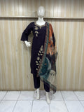 Mannequin wearing a purpal traditional outfit with a saree against a striped