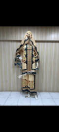 Traditional outfit with intricate patterns on a mannequin against a plain background