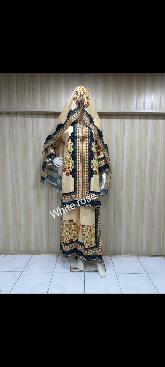 Traditional outfit with intricate patterns on a mannequin against a plain background