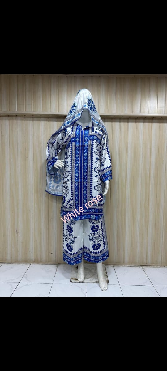 Mannequin wearing a blue and white patterned dress against a striped