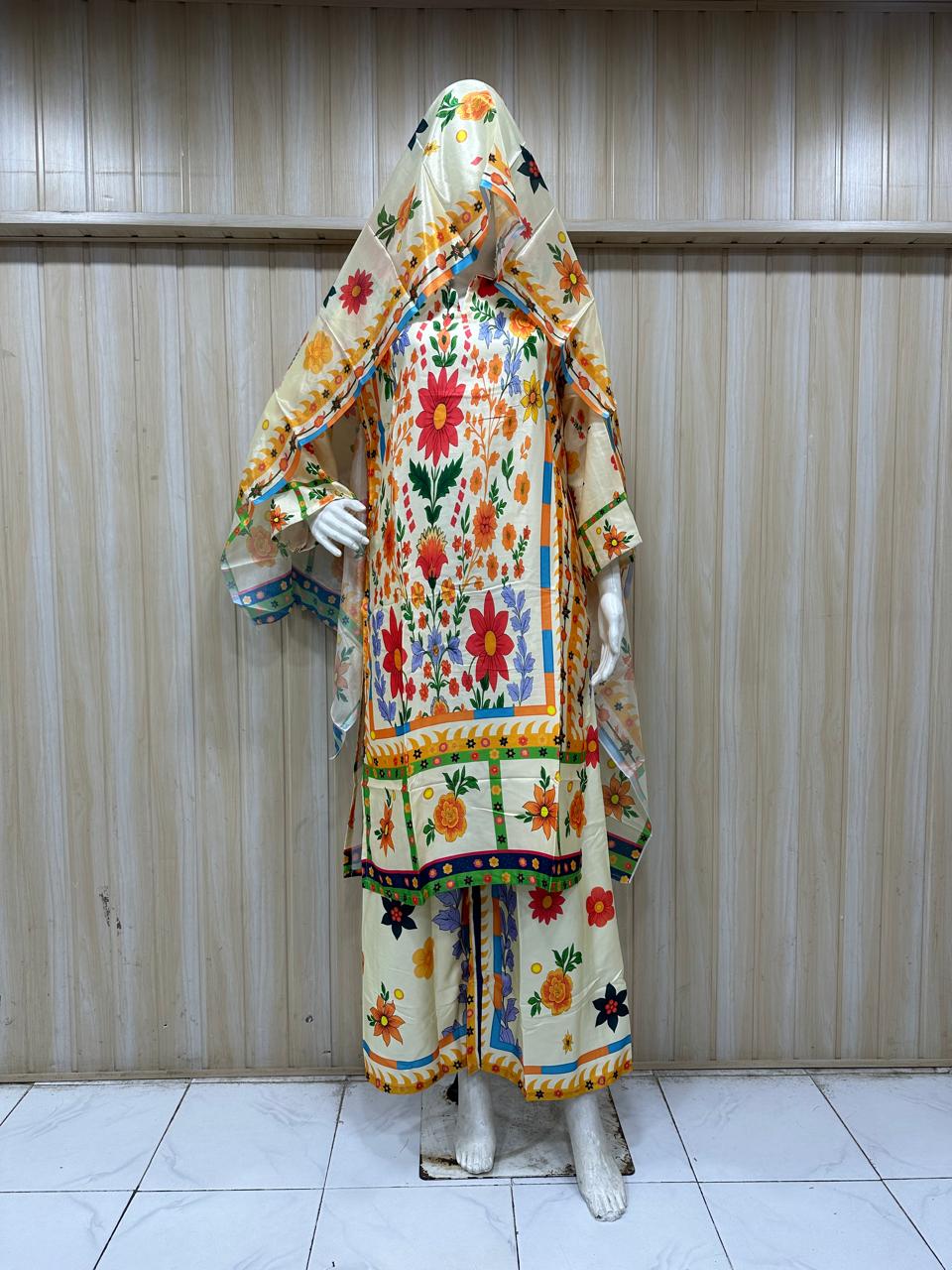 Colorful embroidered traditional outfit on a mannequin against a striped