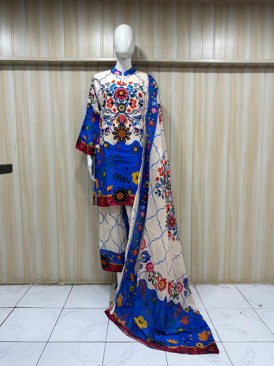 Colorful traditional outfit with floral patterns on a mannequin against a striped