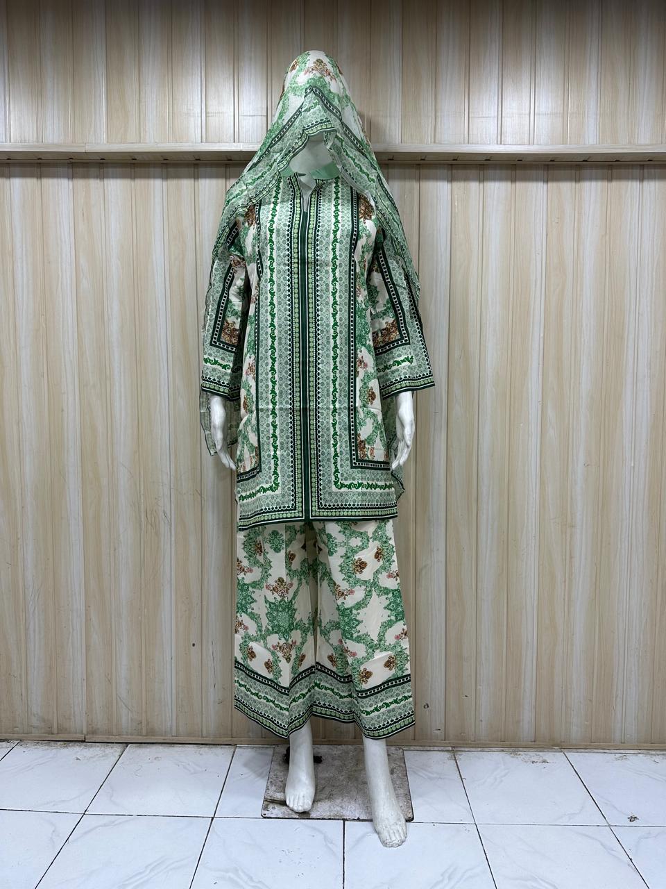 Mannequin wearing a green and white patterned outfit against a striped