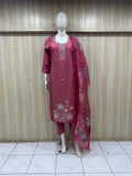 Maroon embroidered outfit with a dupatta on a mannequin against a striped