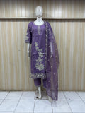 Purple embroidered outfit on a mannequin against a striped
