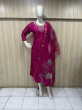 Mannequin wearing a magenta embroidered traditional outfit against a striped  ChatGPT4:05 PM