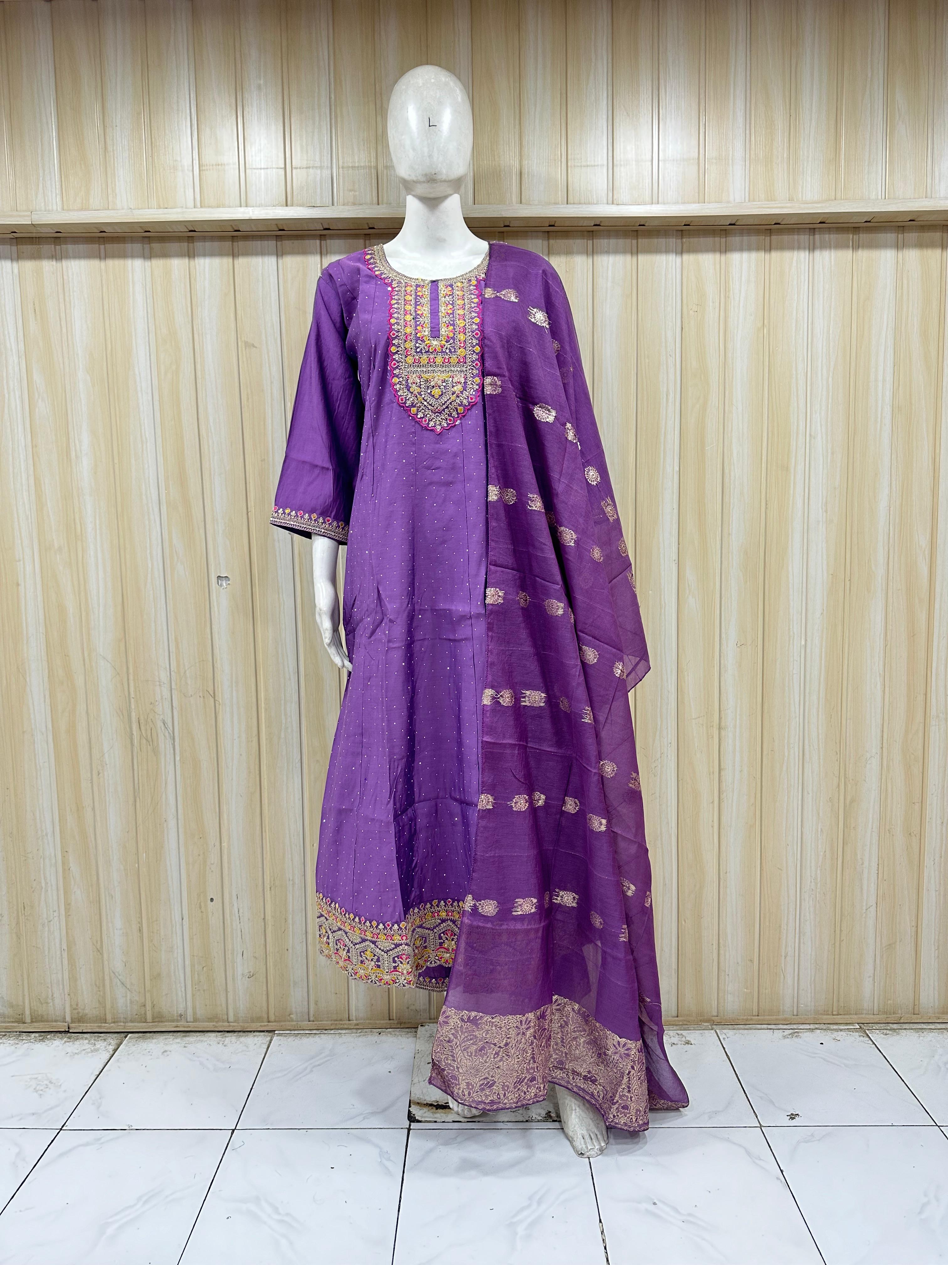 Purple traditional outfit with intricate designs on a mannequin against a striped