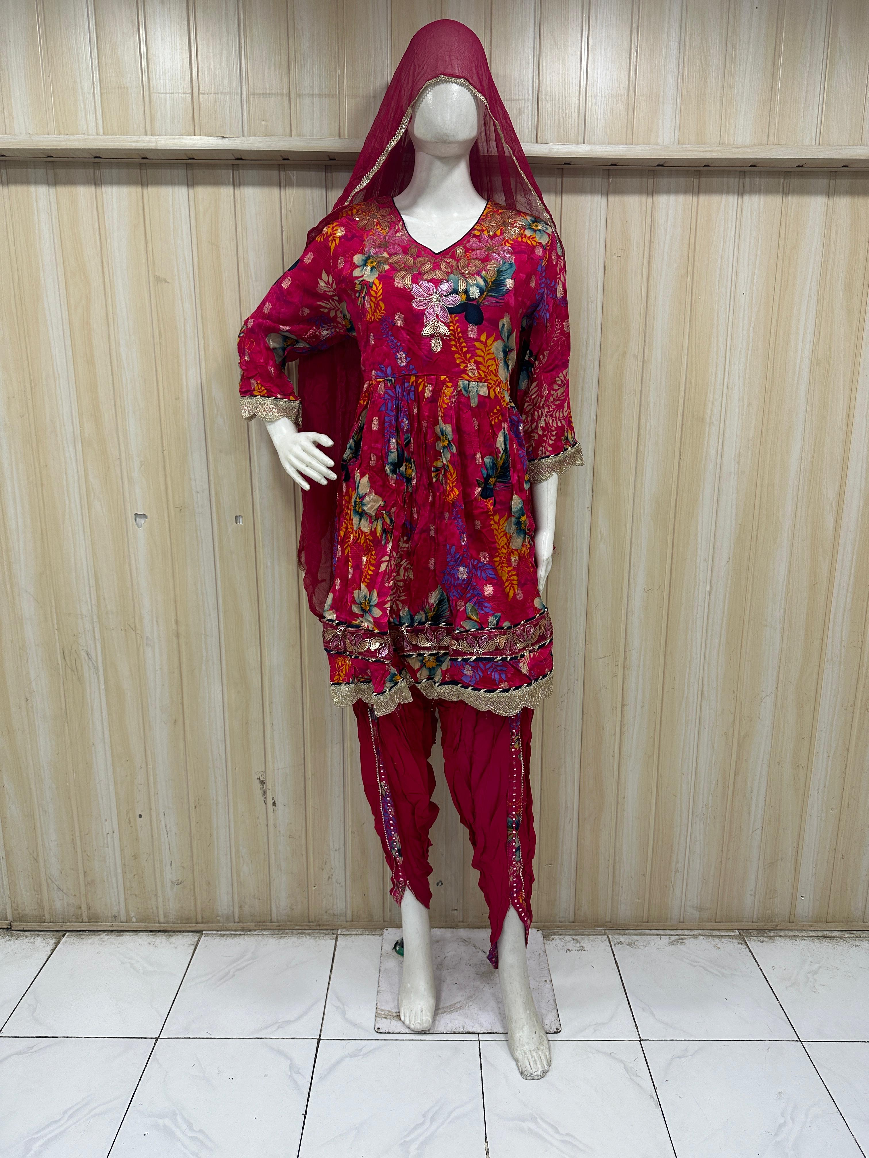 dark pink traditional outfit with a veil on a mannequin against a striped