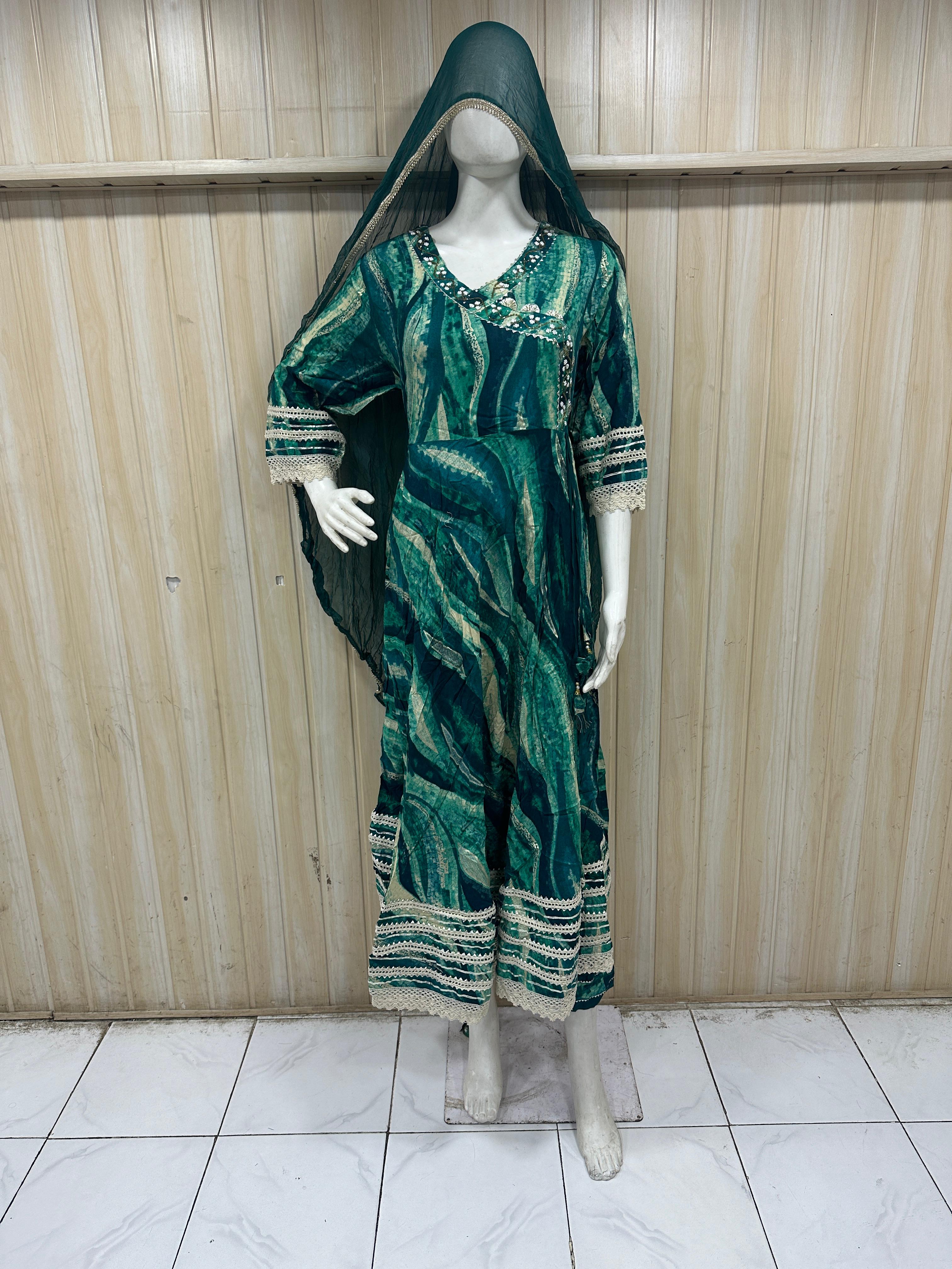 dark green traditional outfit with a veil on a mannequin against a striped