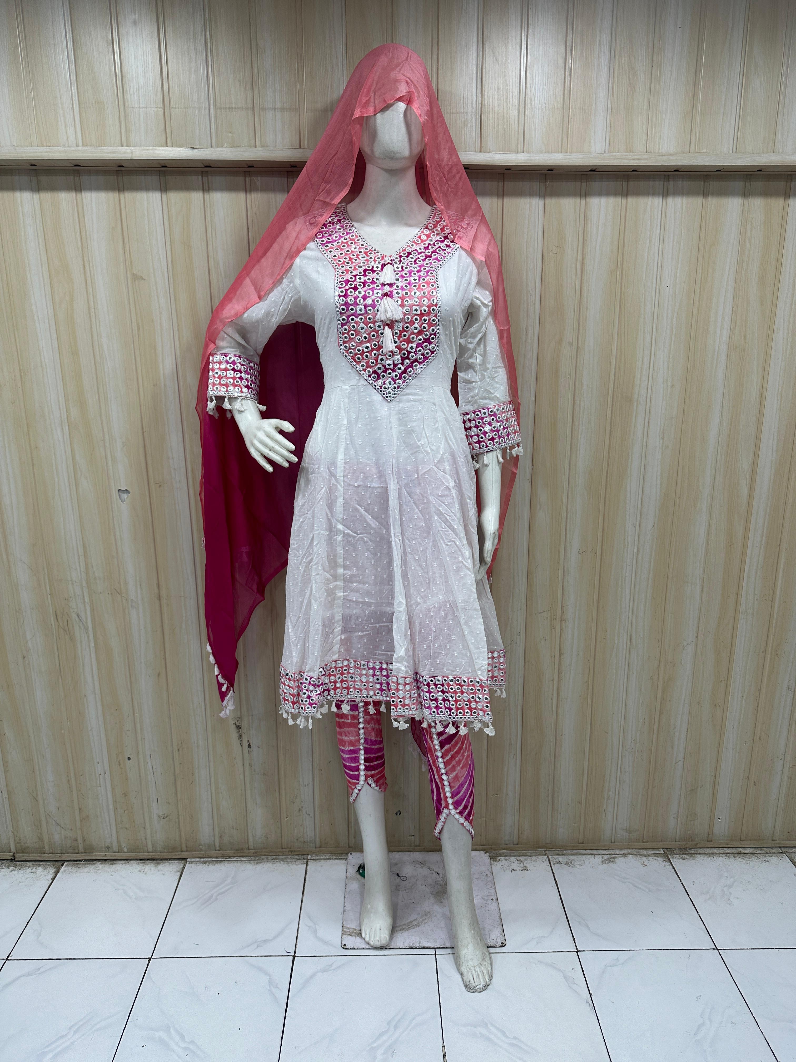 dark pink and white traditional outfit with a veil on a mannequin against a striped